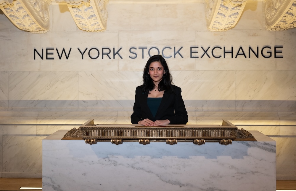 Woman standing in front of NYSE sign